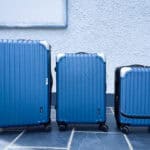 Three suitcases in a line