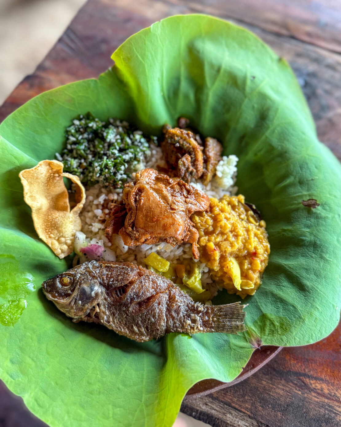 Traditional fish meal with curries served on leaf in Sri Lanka
