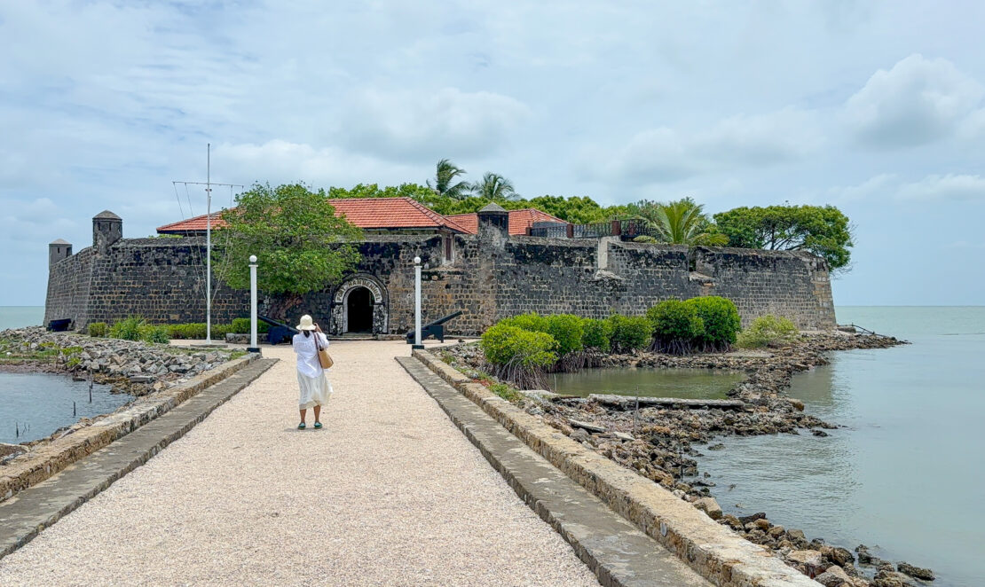 Woman stands at the entrance to Fort Hammenhiel in Jaffna, Sri Lanka - things to do in Jaffna
