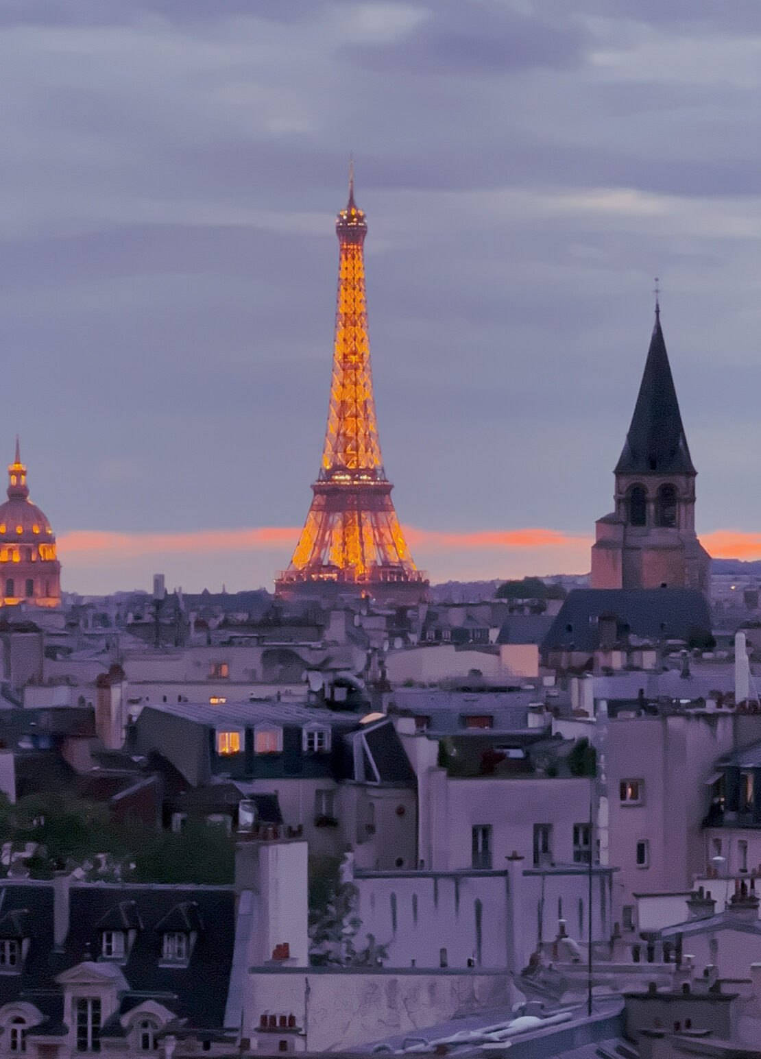 Eiffel tower at twilight seen from rooftop of Hotel Dame des Arts Paris Latin Quarter