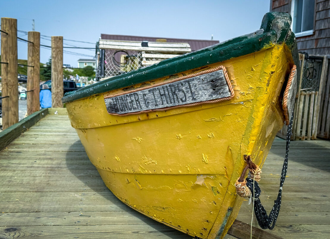 Yellow fishing boat on the dock in Peggy's Cove, Nova Scotia - things to do in Peggy's Cove