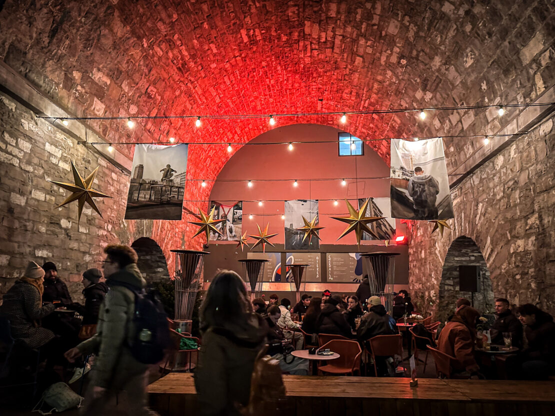 Bar with Christmas decorations under arches in Flon Lausanne Switzerland