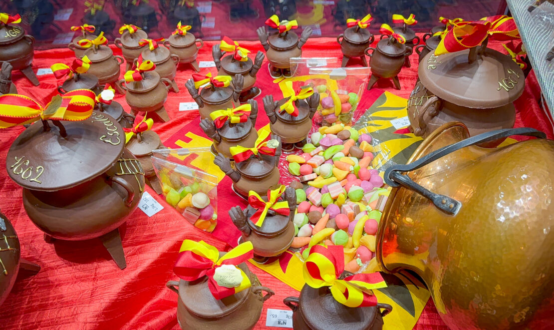 Cauldron spilling marzipan sweets in shop window in Geneva