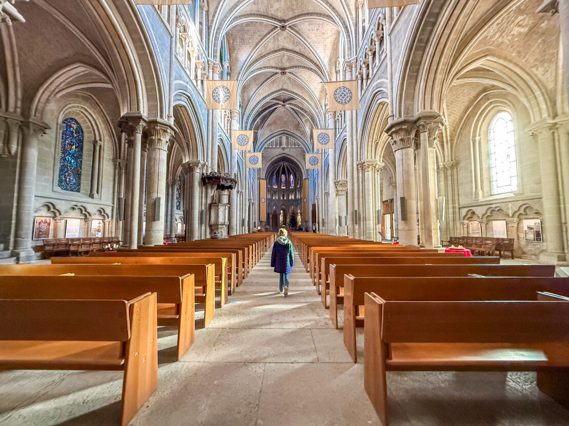 Girl inside Lausanne Cathedral