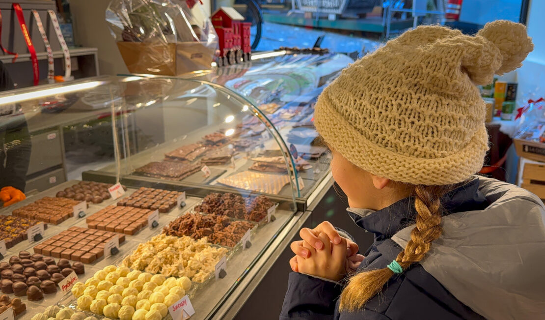 Girl looking at chocolate choices in Lausanne Switzerland