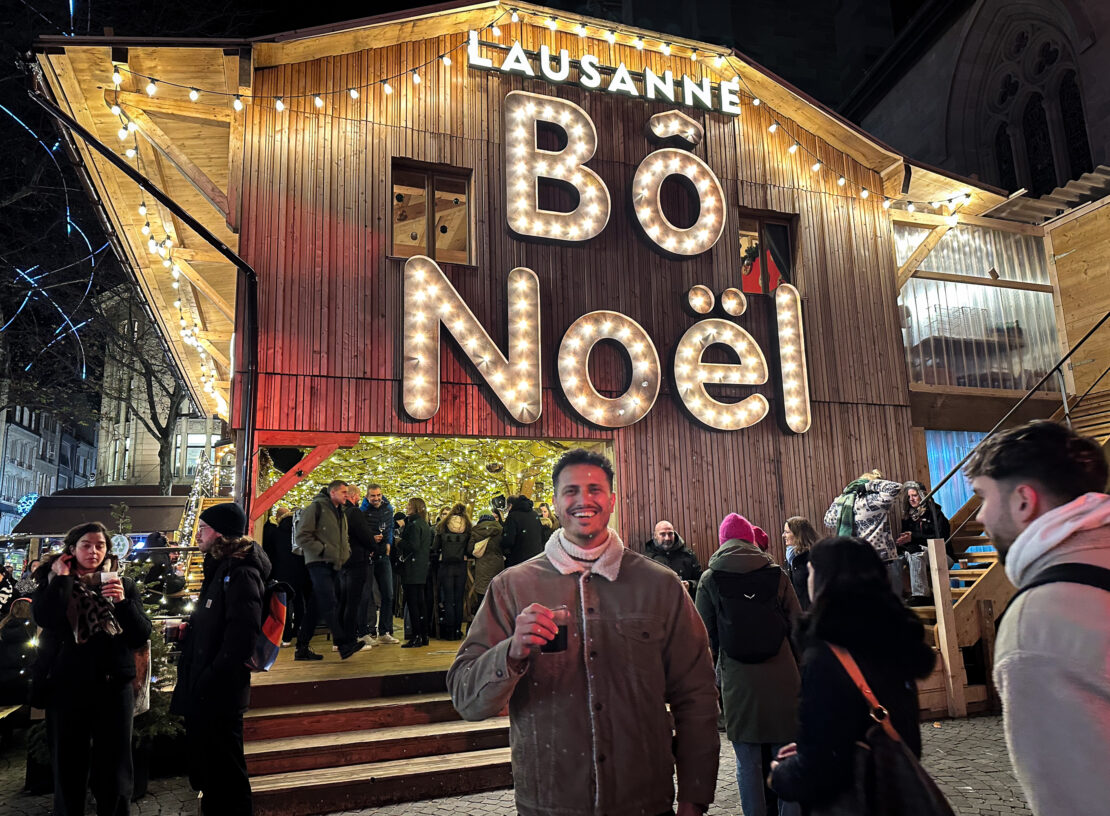 Lausanne Bo Noel sign with man with mulled wine Lausanne Switzerland
