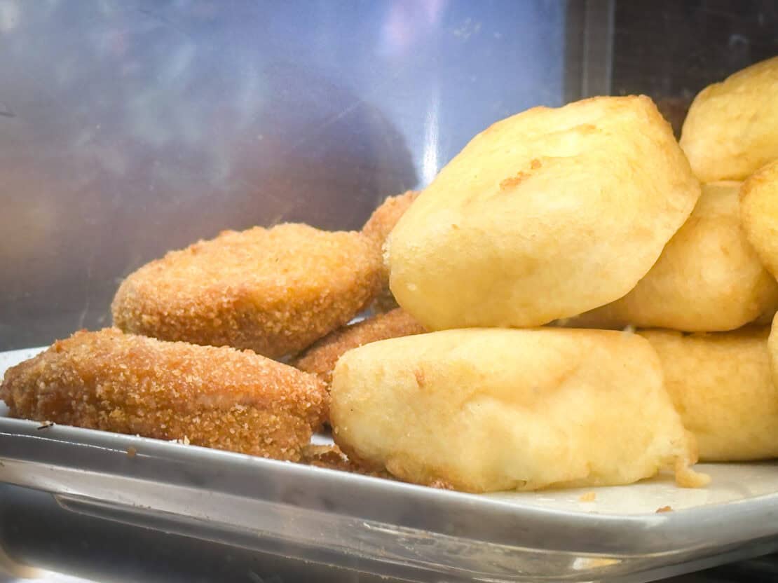 Selection of fried cicchetti displayed in a traditional Venetian bacaro