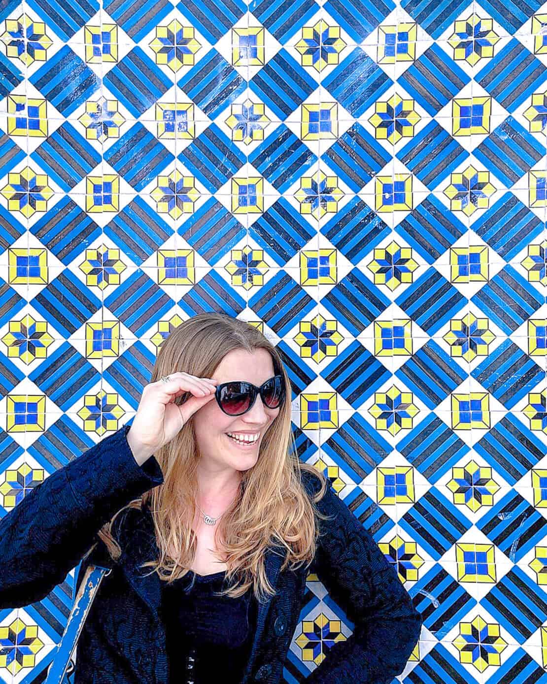 Abigail King by Portuguese ceramic tiles in Portugal