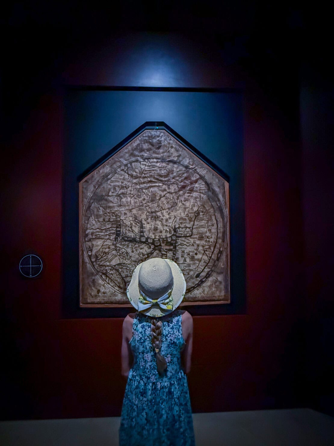 Girl examining the Mappa Mundi at Hereford Cathedral in Herefordshire