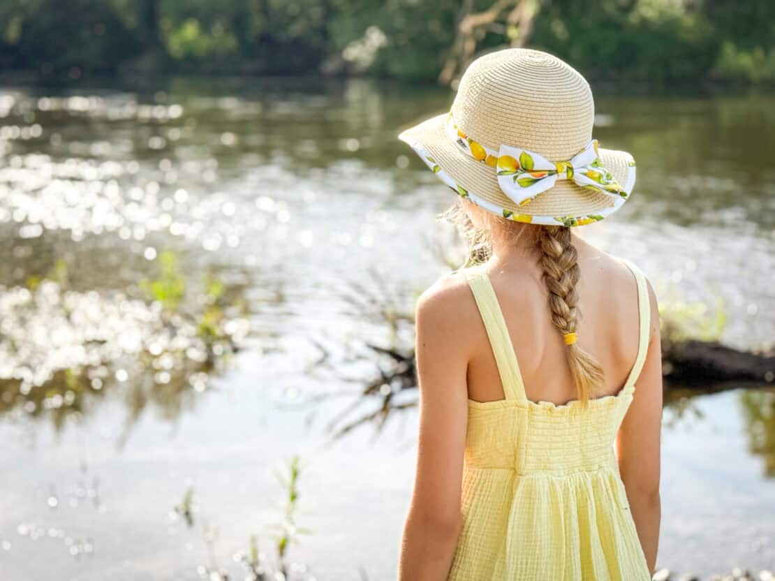 Girl looking over the River Wye and surrounding woodland in the Wye Valley, Herefordshire
