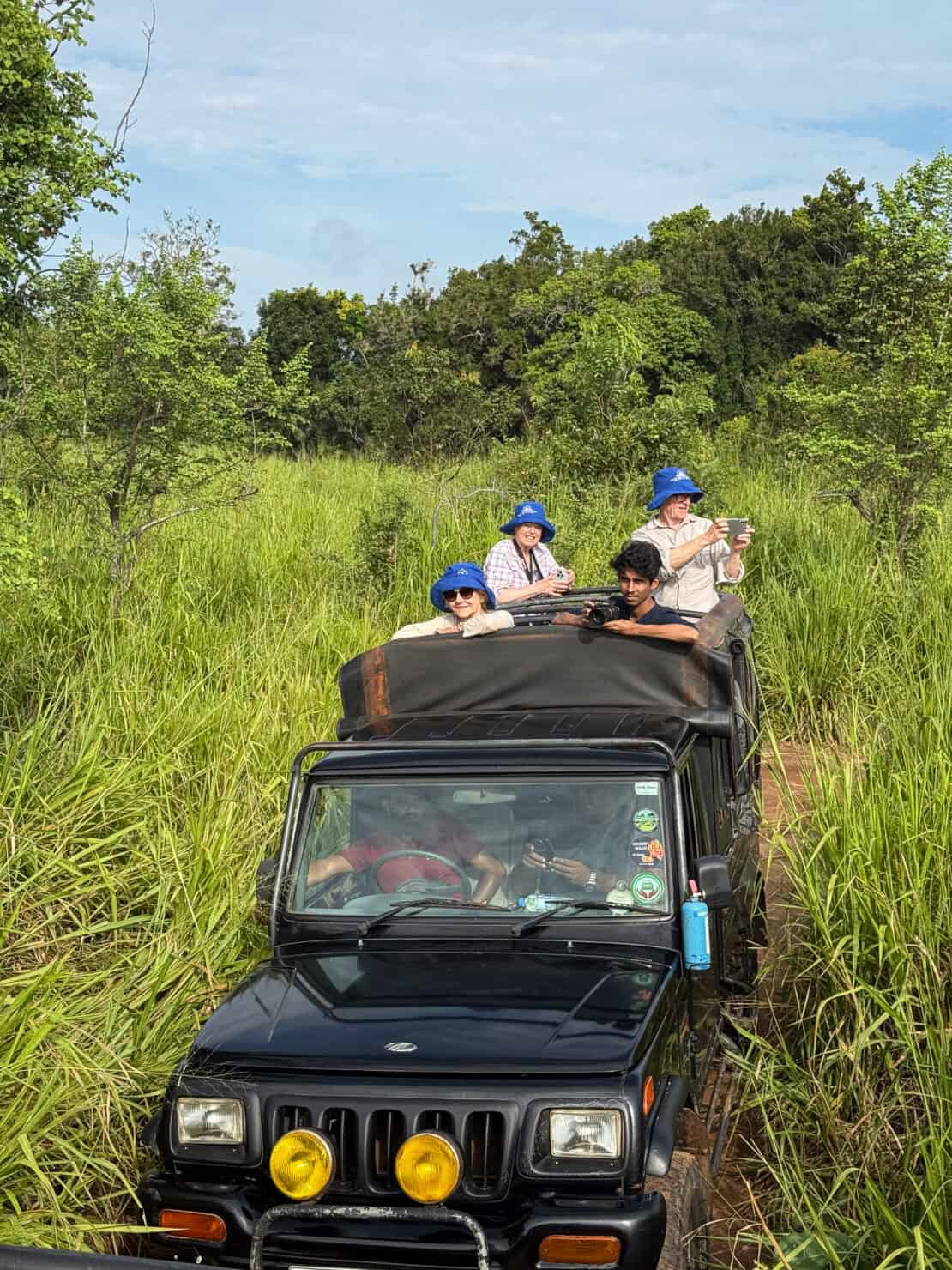 tourists in a safari jeep in Hurulu, Sri Lanka