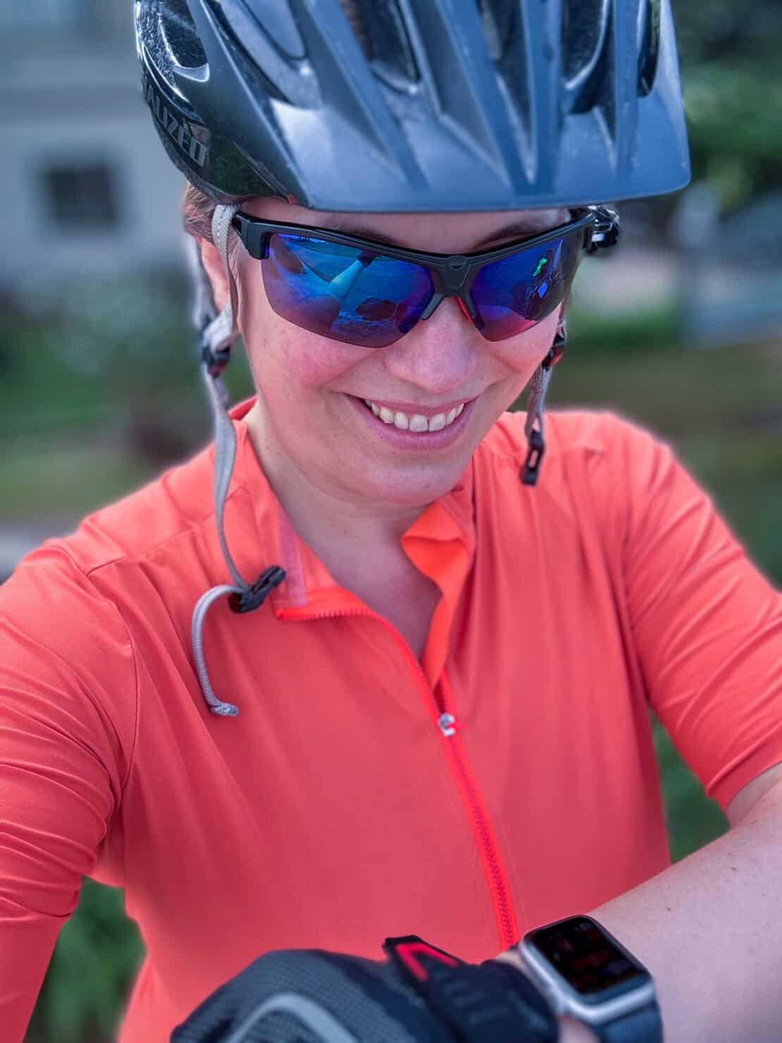 Abigail King checking her Apple watch while cycling through Europe