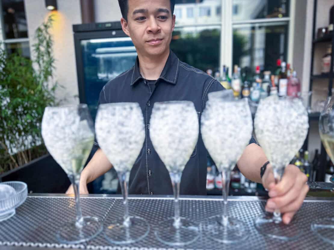 Barman preparing drinks at the Monkey Bar Prague Czech Republic