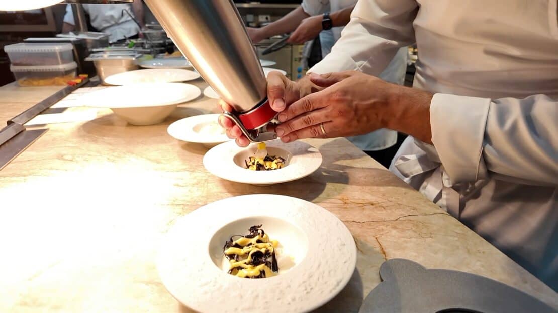 Chef working on a plate at Stangl restaurant in Prague