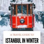 Red historic tram covered in snow on Istanbul's Istiklal Street during winter, with pedestrians walking through the snowy street