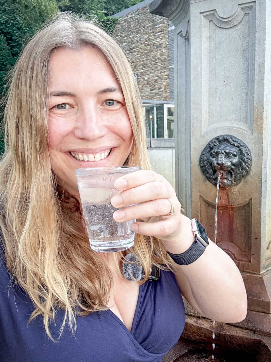 Abigail King drinking water in Spa, Belgium