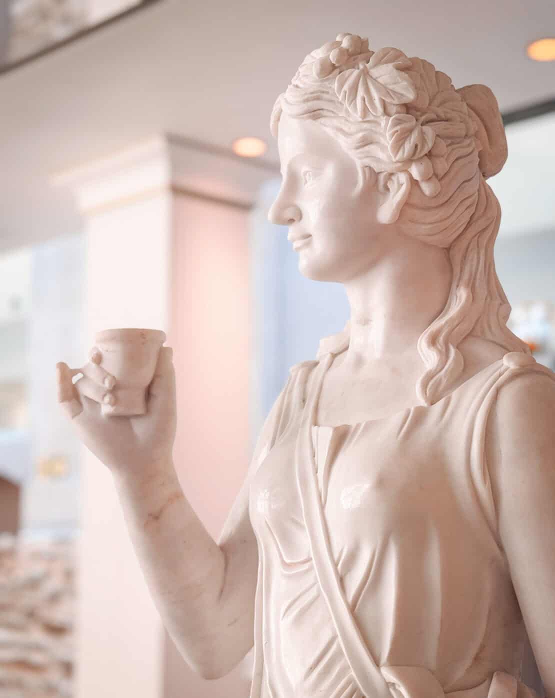 Statue of a woman drinking water in Spa, Belgium
